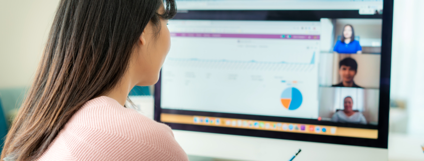  woman talking to her colleagues using cloud-based communication solutions; hybrid work communication